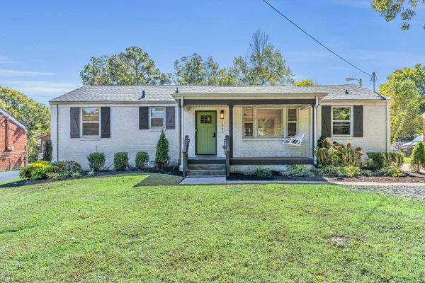 front view of a house with a yard