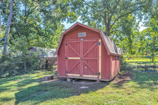 a view of backyard of house with swimming pool