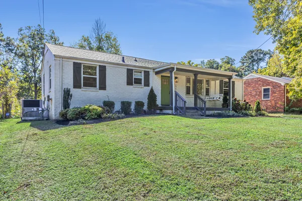 front view of a house with a yard
