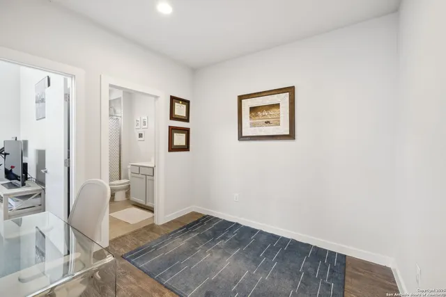 a view of kitchen with furniture and wooden floor