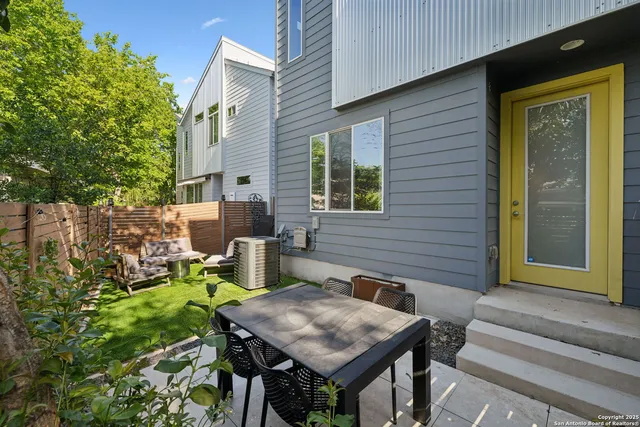 a backyard of a house with seating space