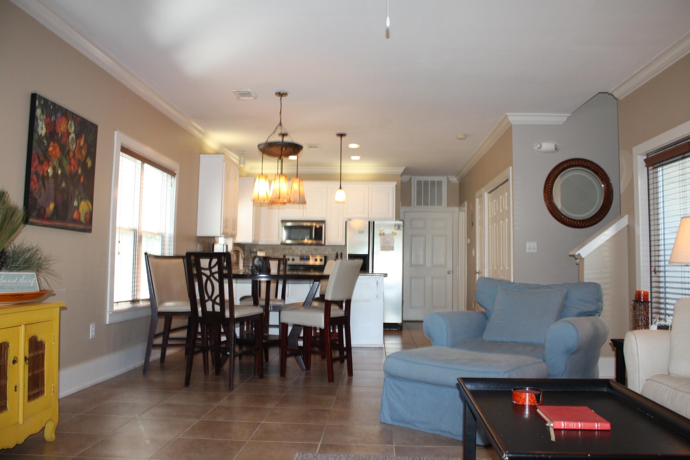 516 Hidden Lake Way Santa Rosa Beach, FL 32459 - Photo 2 of 24 a view of a dining room with furniture and a chandelier