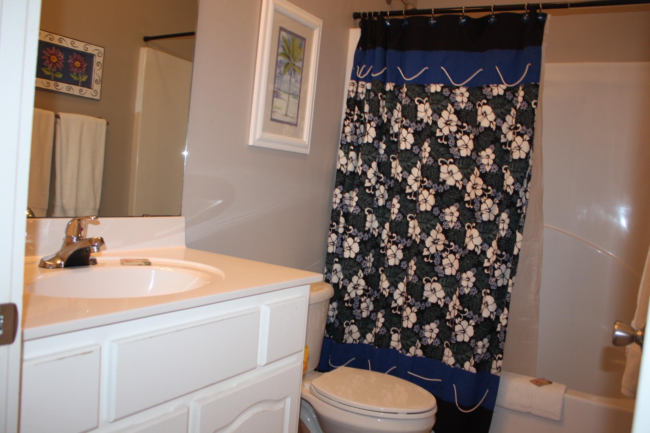 516 Hidden Lake Way Santa Rosa Beach, FL 32459 - Photo 14 of 24 a bathroom with a sink toilet and shower