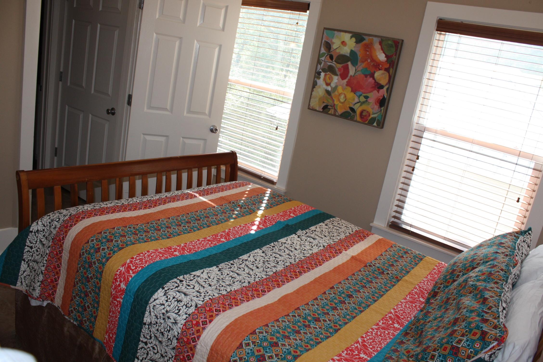 516 Hidden Lake Way Santa Rosa Beach, FL 32459 - Photo 16 of 24 a bedroom with a bed and a window