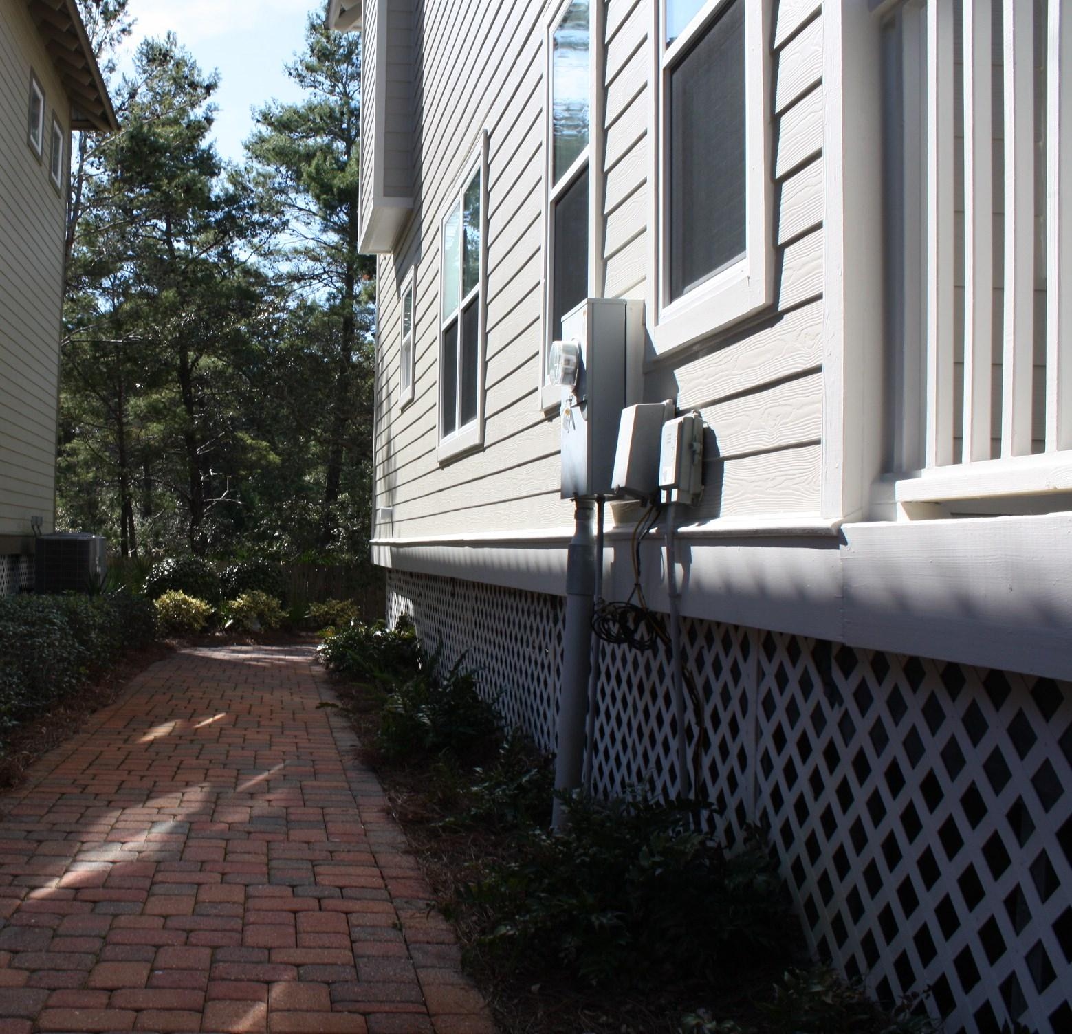 516 Hidden Lake Way Santa Rosa Beach, FL 32459 - Photo 18 of 24 a backyard of a house with wooden fence