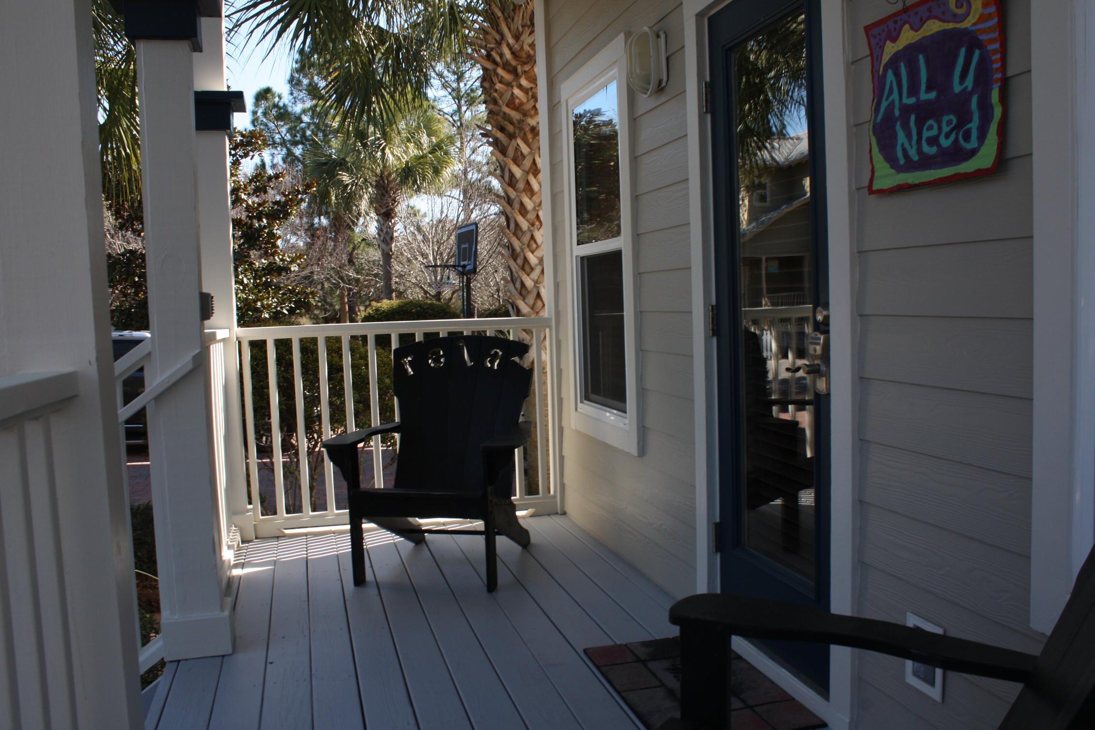 516 Hidden Lake Way Santa Rosa Beach, FL 32459 - Photo 19 of 24 a view of a balcony with chairs and wooden floor