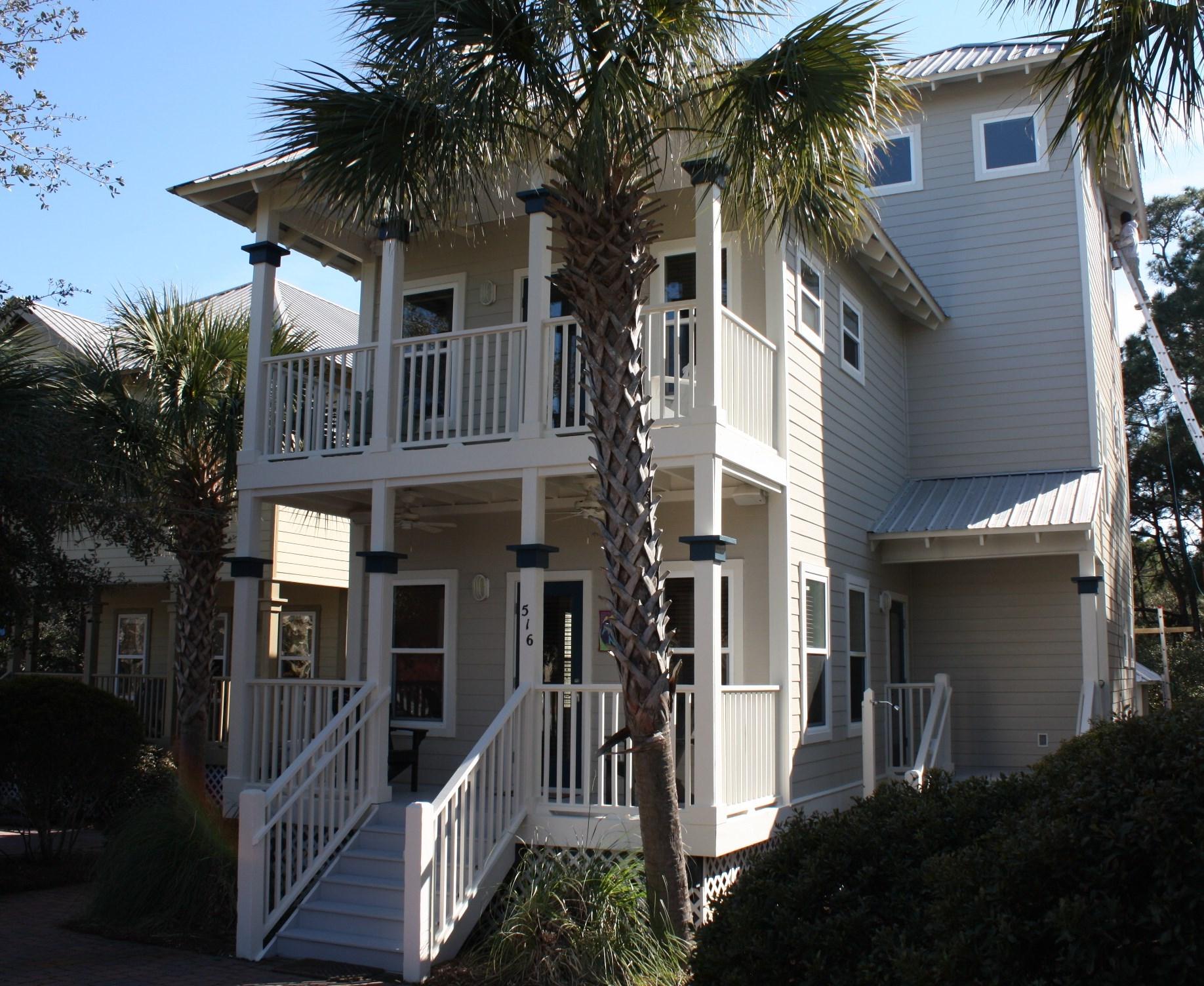516 Hidden Lake Way Santa Rosa Beach, FL 32459 - Photo 20 of 24 a front view of a house with a yard