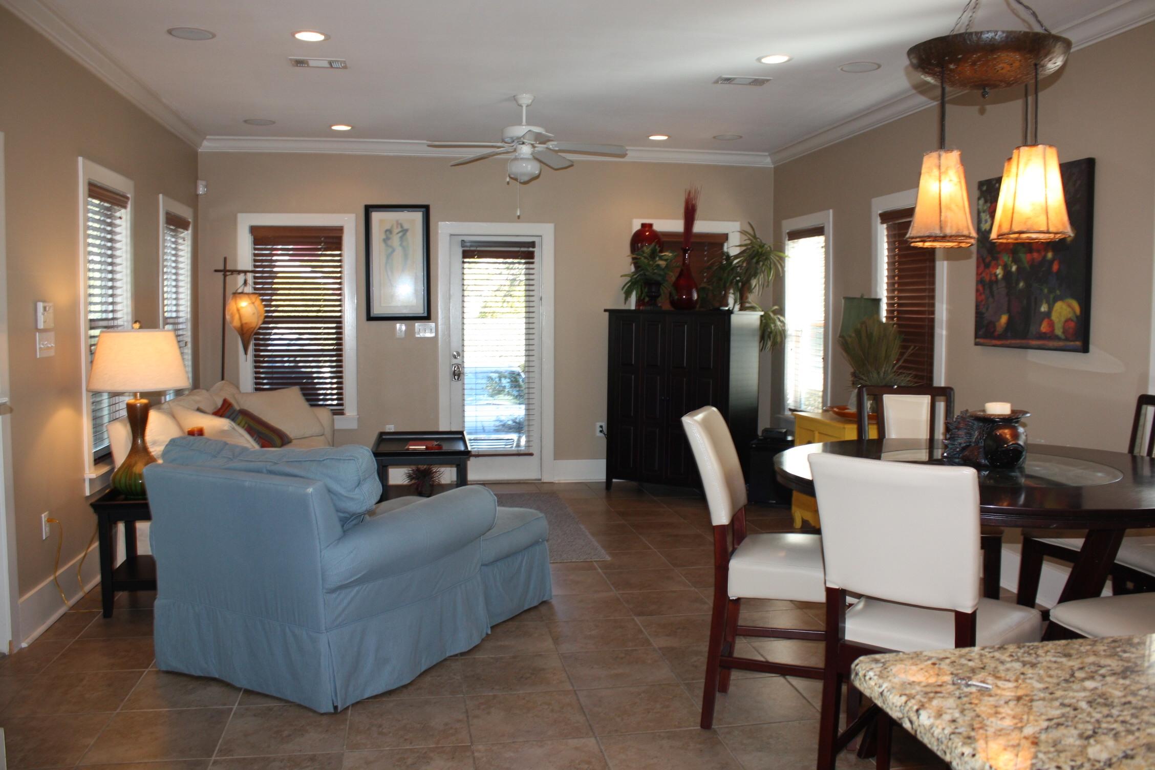 516 Hidden Lake Way Santa Rosa Beach, FL 32459 - Photo 3 of 24 a living room with furniture a lamp and a chandelier