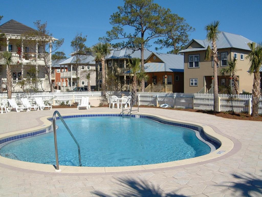 516 Hidden Lake Way Santa Rosa Beach, FL 32459 - Photo 22 of 24 a view of a house with a swimming pool