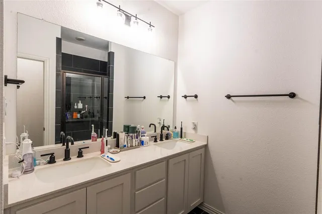 a bathroom with a sink and mirror