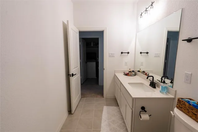 a bathroom with a sink a tub and mirror