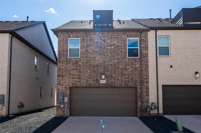 a front view of a house with parking space
