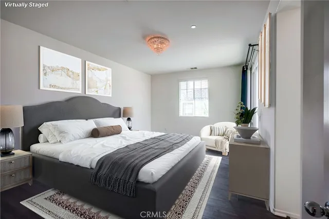 a bedroom with a bed and a potted plant