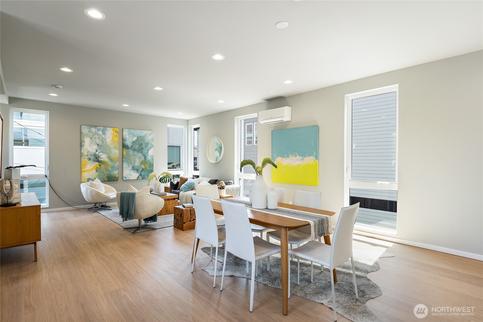 1801 Northwest 65th Street, Unit C Seattle, WA 98117 - Photo 11 of 40 a living room with fireplace furniture and a wooden floor