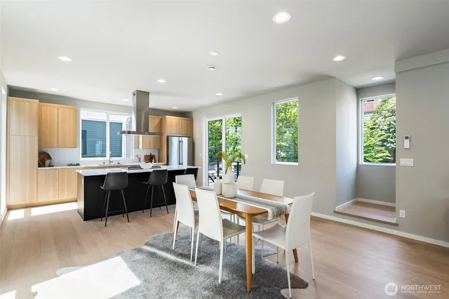 a kitchen with a table and chairs in it