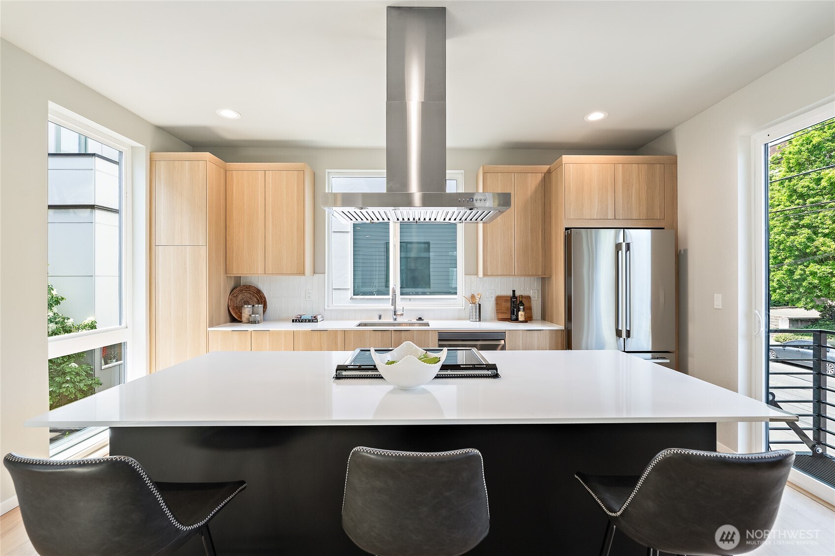 1801 Northwest 65th Street, Unit C Seattle, WA 98117 - Photo 16 of 40 a kitchen with a table chairs and refrigerator