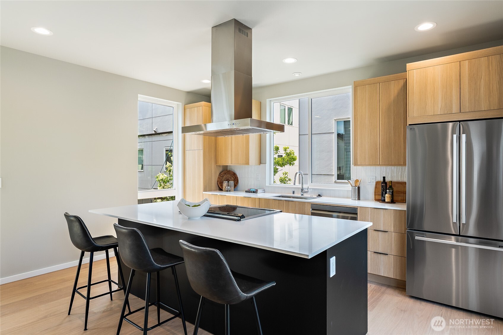 1801 Northwest 65th Street, Unit C Seattle, WA 98117 - Photo 17 of 40 a kitchen with a table chairs refrigerator and window