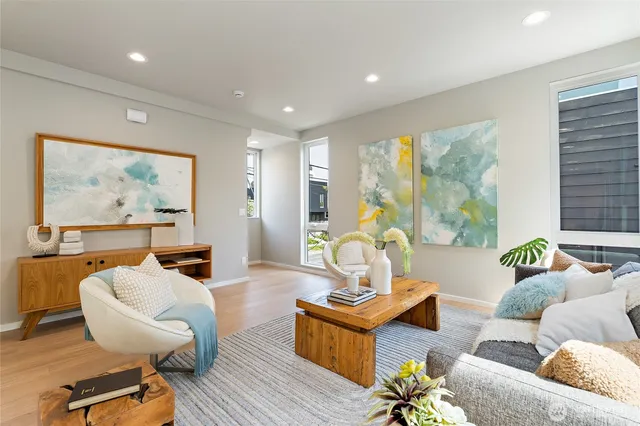 a living room with furniture and a large window