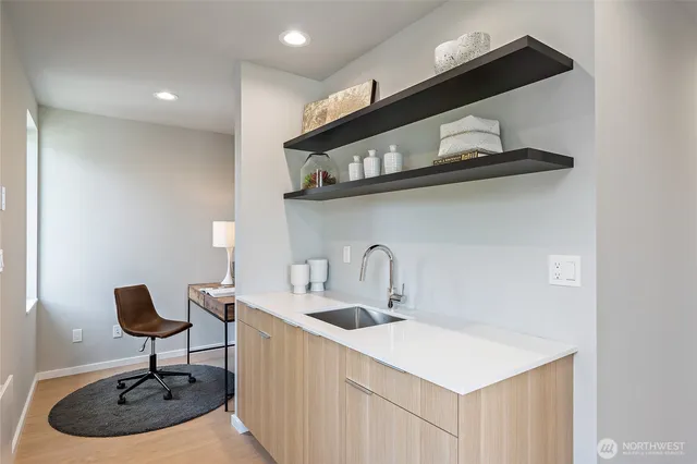 a close view of a sink and a table in a room