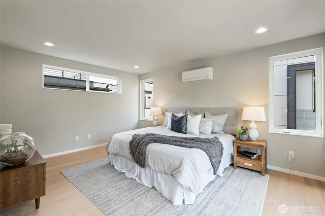 a bedroom with bed and window