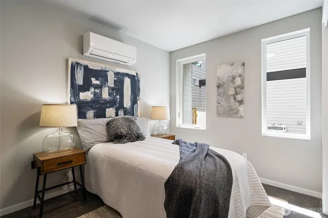 a bedroom with a bed and window