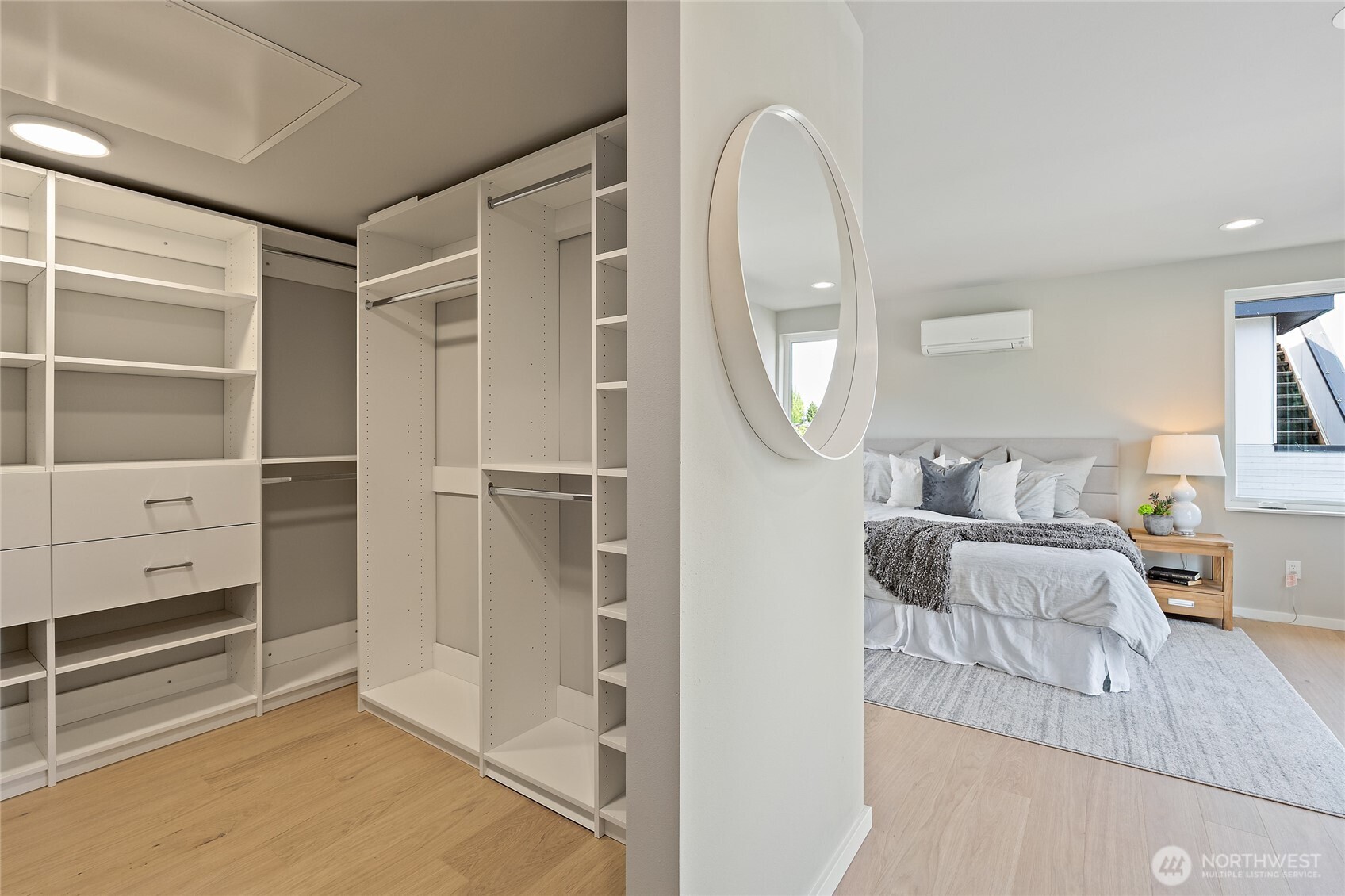 1801 Northwest 65th Street, Unit C Seattle, WA 98117 - Photo 35 of 40 a living room with furniture a mirror and a dresser