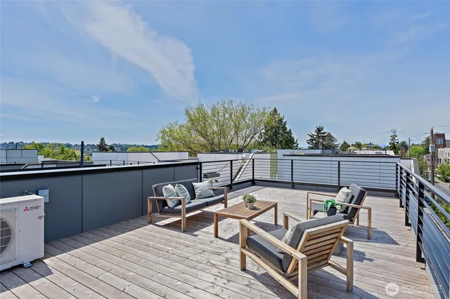 a view of a balcony with two chairs and a table