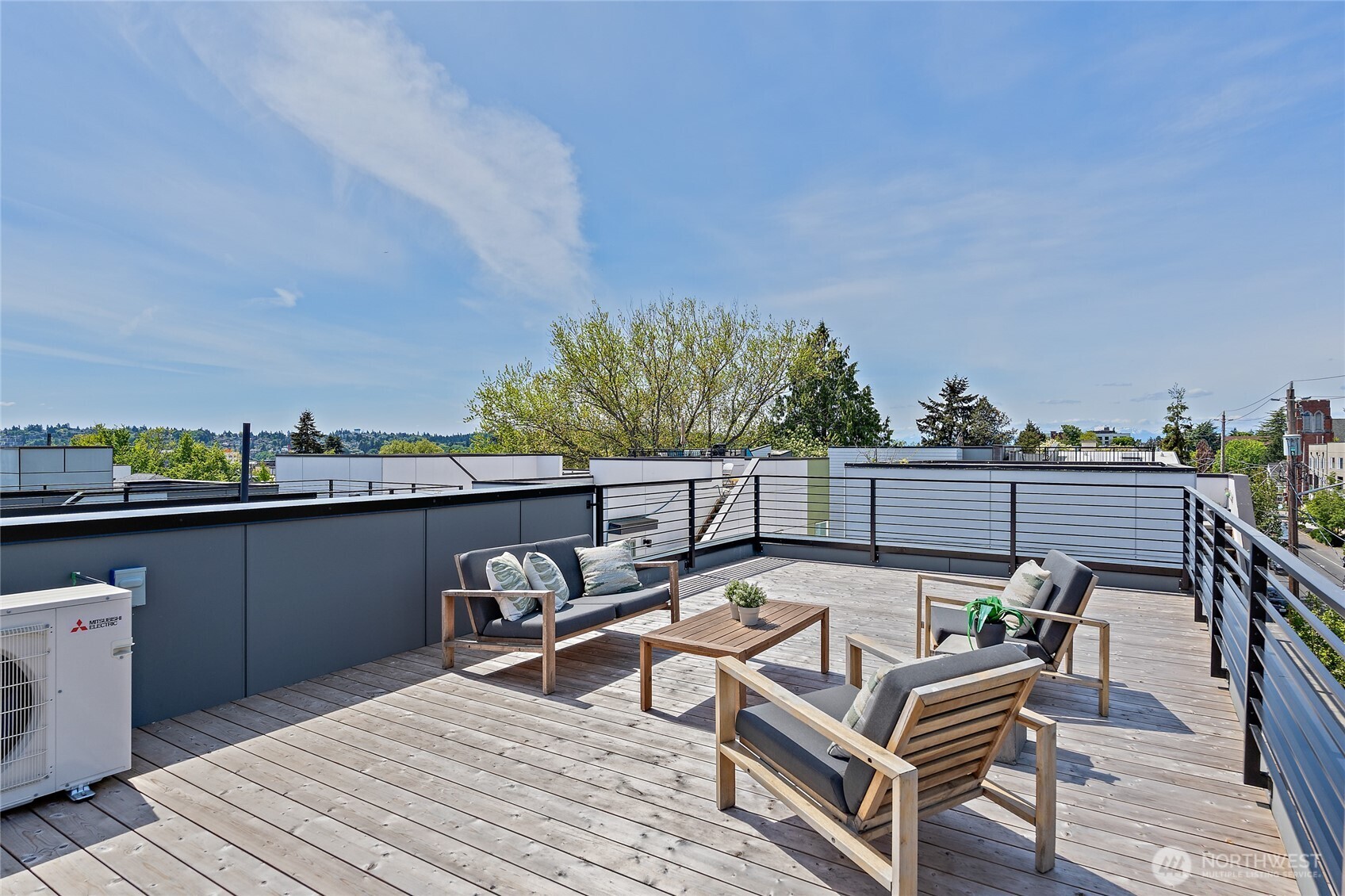 1801 Northwest 65th Street, Unit C Seattle, WA 98117 - Photo 36 of 40 a view of a balcony with two chairs and a table