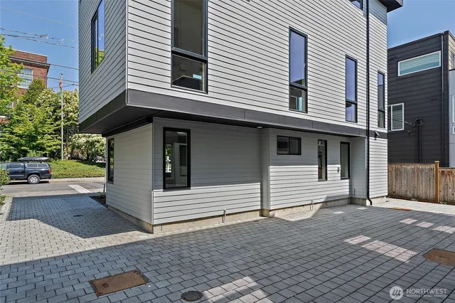 a view of a white house with a large window