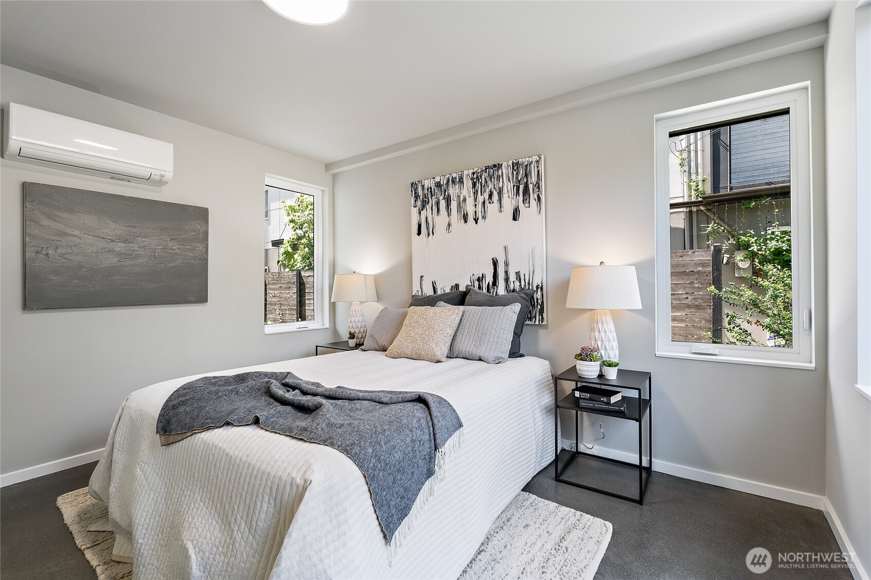 1801 Northwest 65th Street, Unit C Seattle, WA 98117 - Photo 5 of 39 a bedroom with a bed and a window