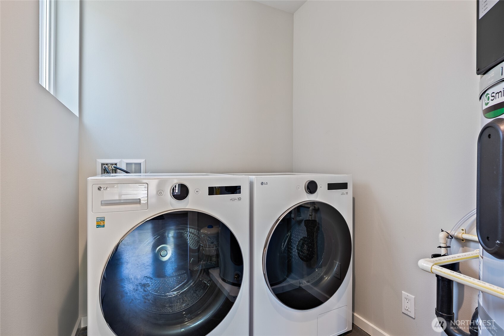 1801 Northwest 65th Street, Unit C Seattle, WA 98117 - Photo 8 of 40 a utility room with dryer and washer