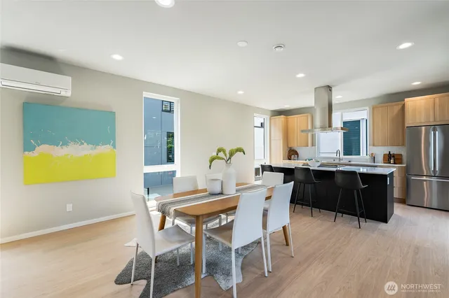 a kitchen with a table and chairs in it