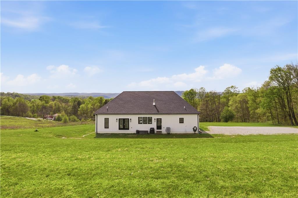 315 Stewarton Road Mill Run, PA 15464 - Photo 43 of 47 a front view of a house with a yard