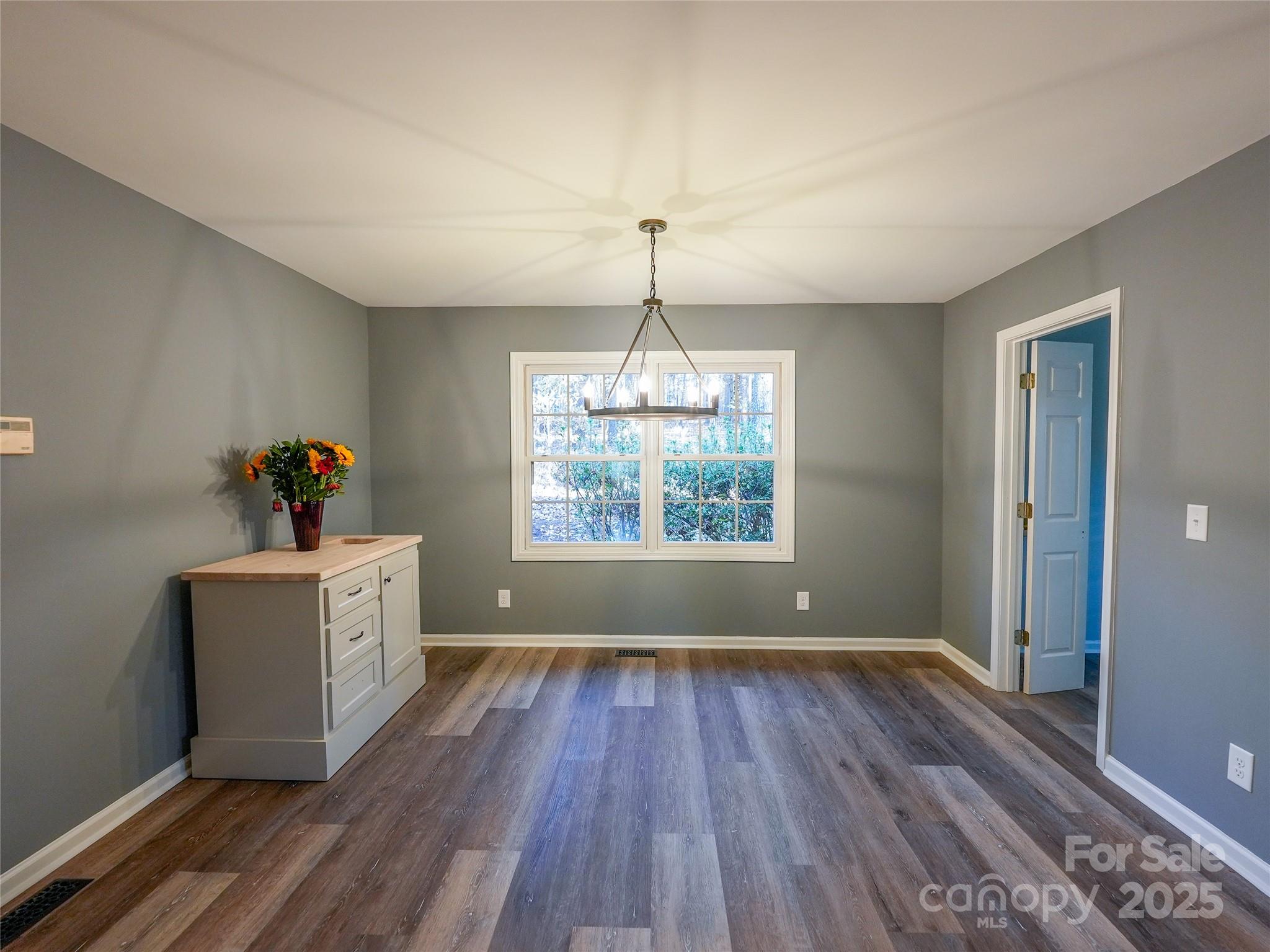 44585 Baldwin Road New London, NC 28127 - Photo 17 of 47 wooden floor in an empty room with a window