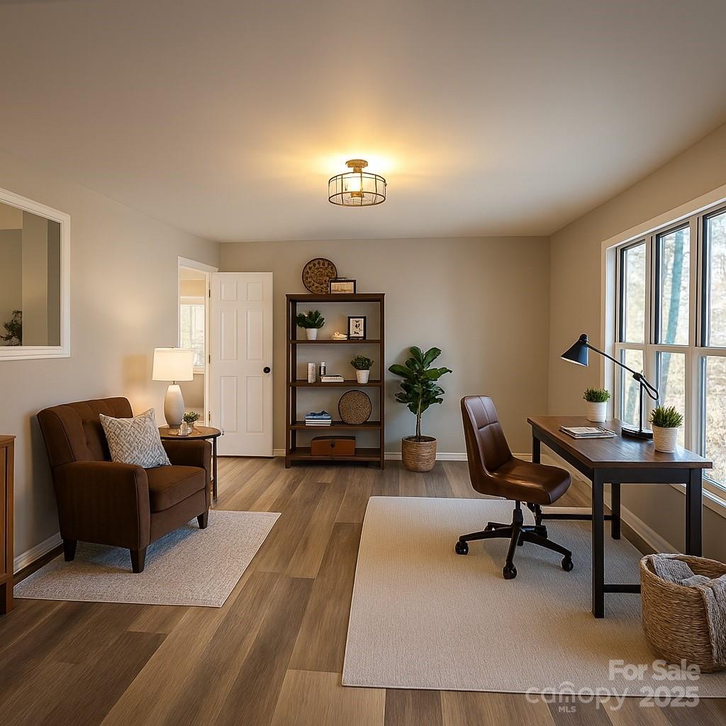 44585 Baldwin Road New London, NC 28127 - Photo 19 of 47 a view of a livingroom with workspace and a couch