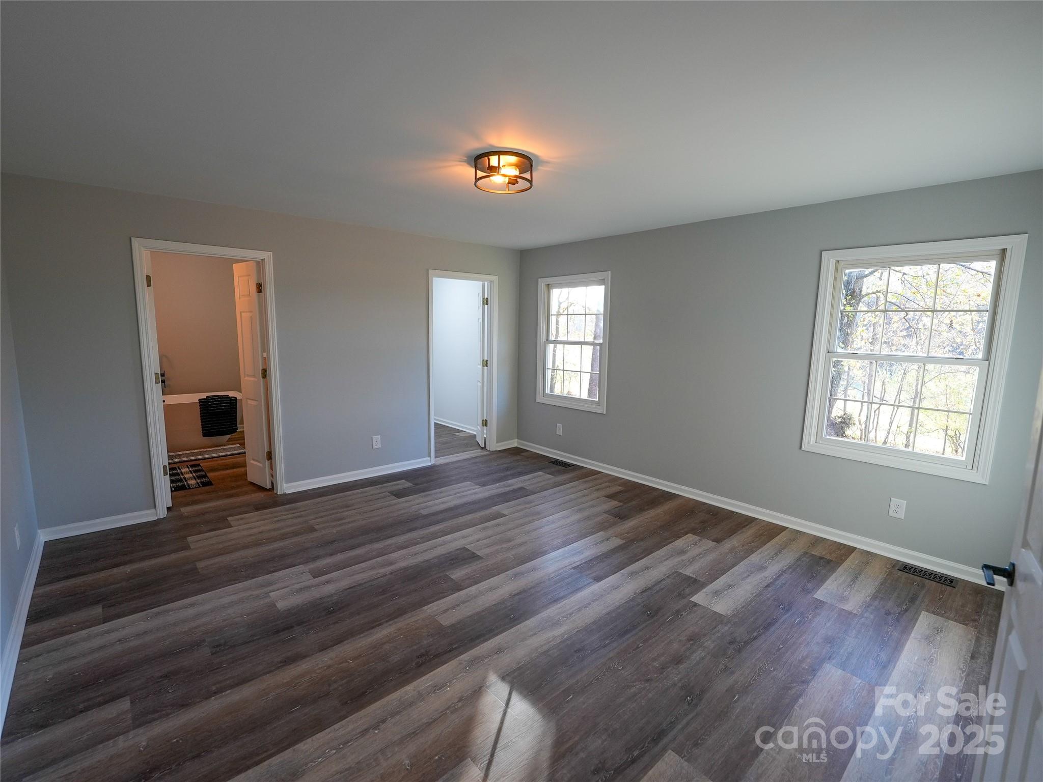 44585 Baldwin Road New London, NC 28127 - Photo 22 of 47 a view of an empty room with window and wooden floor