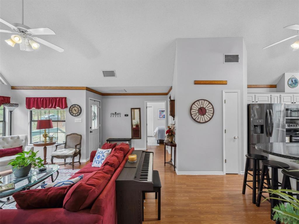 299 Lamplight Path Holly Lake Ranch, TX 75765 - Photo 15 of 40 a living room with furniture and a wooden floor