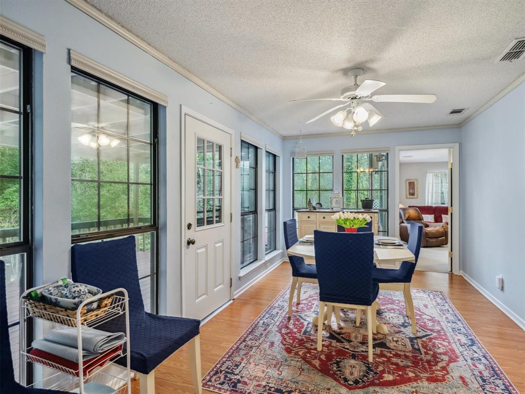 299 Lamplight Path Holly Lake Ranch, TX 75765 - Photo 18 of 40 a work room with furniture and wooden floor