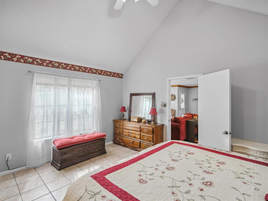 299 Lamplight Path Holly Lake Ranch, TX 75765 - Photo 19 of 40 a bedroom with furniture and window