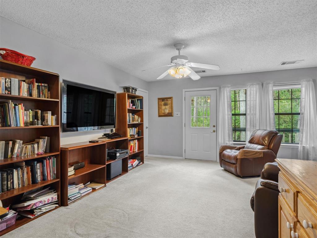 299 Lamplight Path Holly Lake Ranch, TX 75765 - Photo 24 of 40 a view of a livingroom with workspace and a window