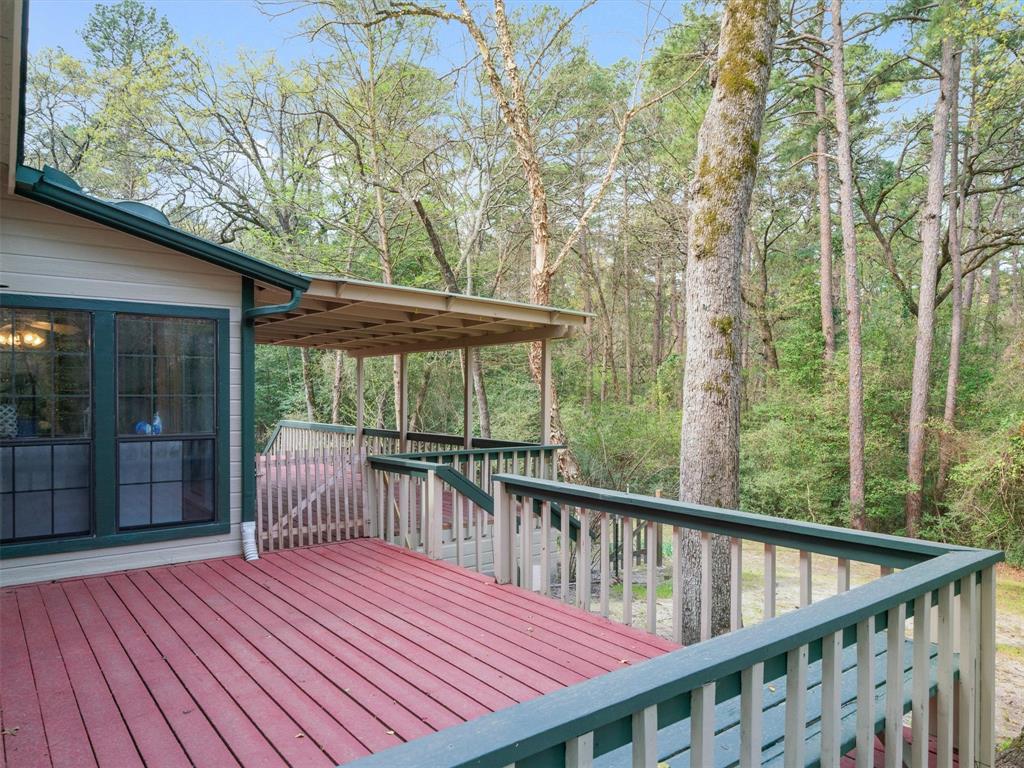 299 Lamplight Path Holly Lake Ranch, TX 75765 - Photo 31 of 40 a view of a wooden deck