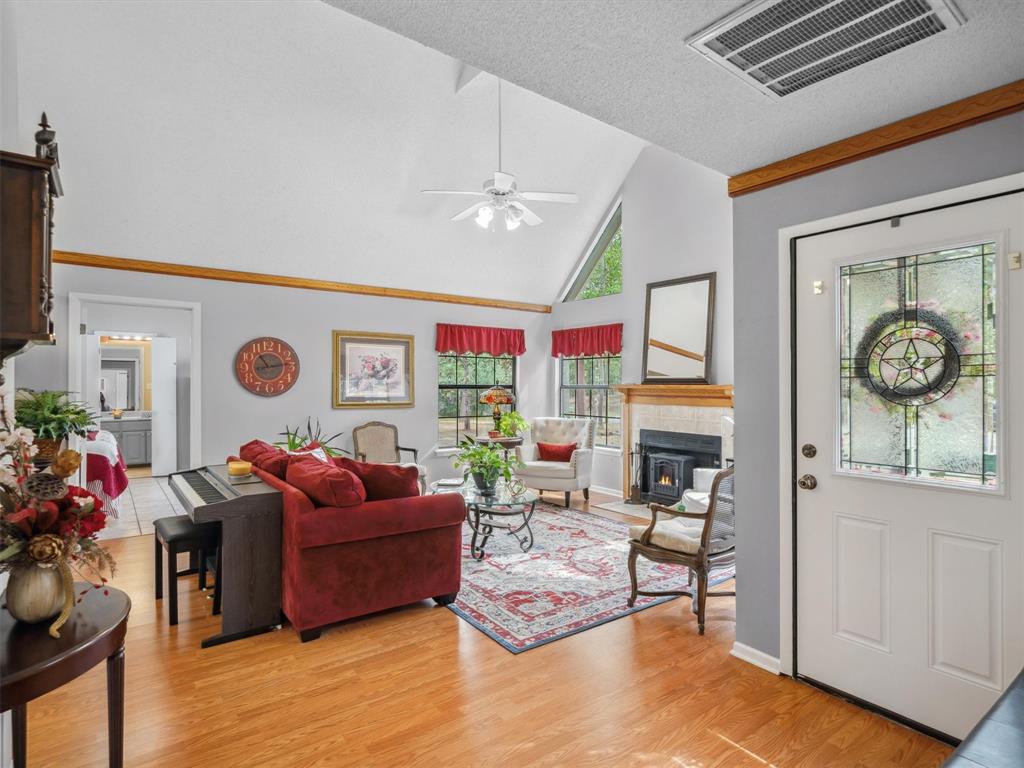 299 Lamplight Path Holly Lake Ranch, TX 75765 - Photo 6 of 40 a living room with fireplace furniture and a flat screen tv