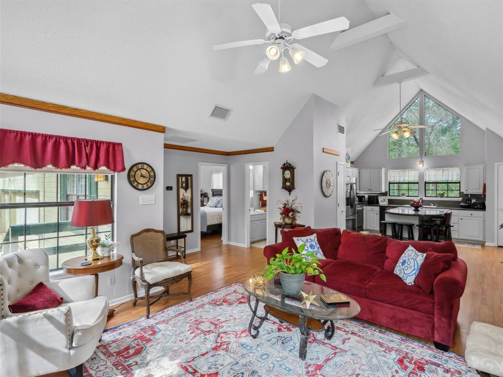 299 Lamplight Path Holly Lake Ranch, TX 75765 - Photo 8 of 40 a living room with furniture and a large window