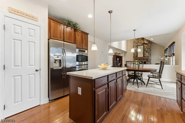 a kitchen with stainless steel appliances granite countertop a stove and refrigerator