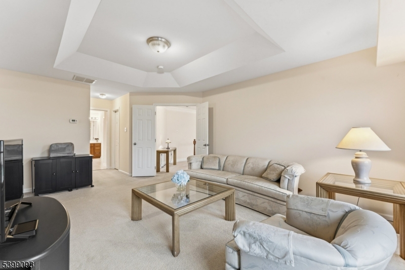 26 Rouser Way Hillsborough, NJ 08844 - Photo 26 of 50 a living room with furniture and a lamp