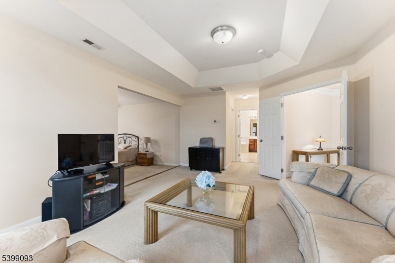 26 Rouser Way Hillsborough, NJ 08844 - Photo 27 of 50 a living room with furniture and a flat screen tv