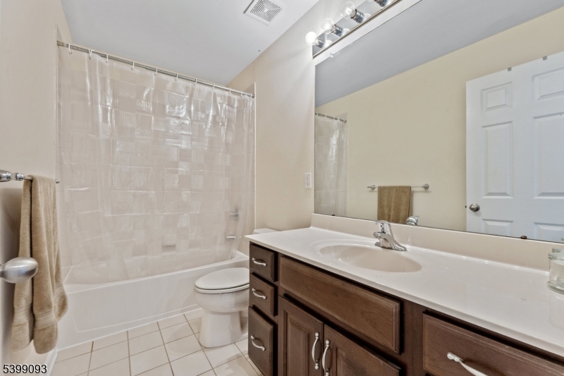 26 Rouser Way Hillsborough, NJ 08844 - Photo 38 of 50 a bathroom with a sink a toilet and shower