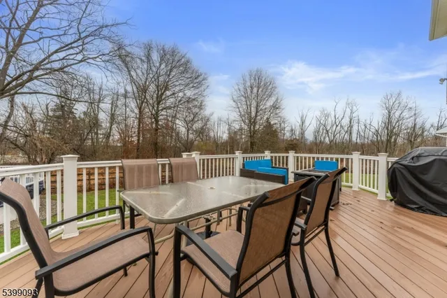 a view of a chairs and table on the deck