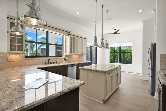 a living room with a couch and a stove next to a window