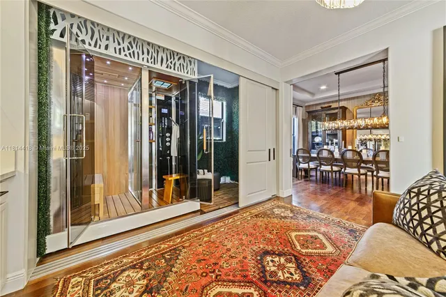 a view of an empty room with a window and a ceiling fan